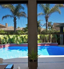 Black exterior shades by pool Photo